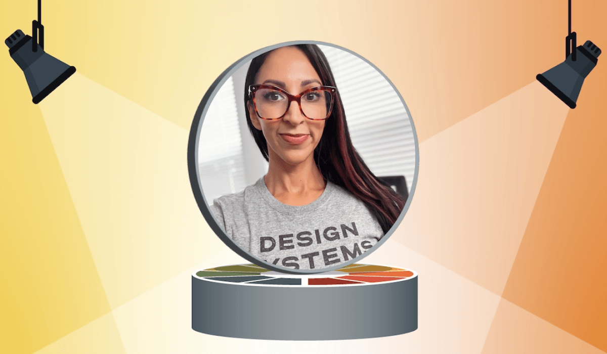 Crystal Ledesma wearing a Design Systems shirt in a spotlight
